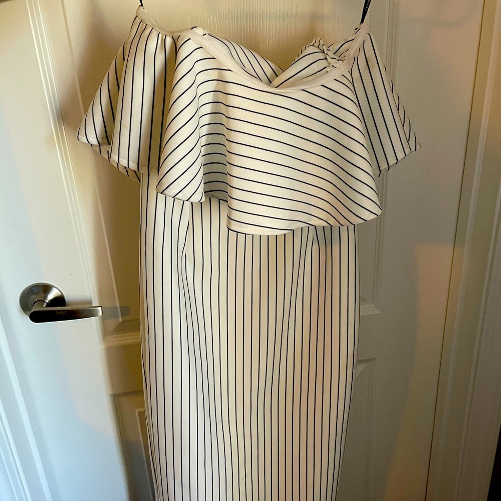 Off the shoulder dress. Dress falls below knee.